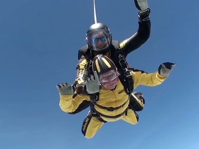 In this grab taken from video, Verdun Hayes gestures as he tandem skydives in Devon, England, Sunday, May 14, 2017. (Skydive.buzz via AP)