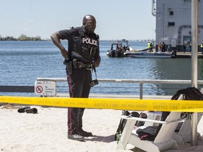 Toronto Police investigate the scene at Sugar Beach where a man went into the water and had to be rescued on Monday, May 17, 2017. (Craig Robertson/Toronto Sun)