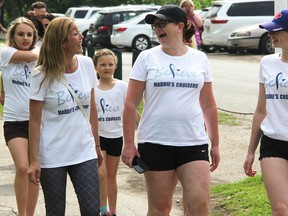 Maria Michelin, front left, Christine Bouffard and Simone Bouffard, Christine's daughter, were among dozens participating in last year's Walk to Make Cystic Fibrosis History at Canatara Park. This year's is set for May 28. (Tyler Kula/Sarnia Observer/Postmedia Network)