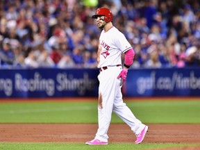 Toronto Blue Jays outfielder Steve Pearce leaves the game with an injury after hitting a double against the Seattle Mariners during second inning American League action in Toronto on May 14, 2017. (THE CANADIAN PRESS/Frank Gunn)