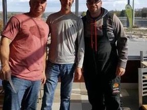 Fishing partners Mike Verbruggen (left) and Shawn Groenerdyk pose with Top 50 executive Ryan Shearer after winning the Gloucester Pool event Saturday, the third stop on the Top 50 Pike Tournament Trail.