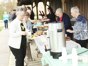 Locals lined up for plates of food May 12. (Shaun Gregory/Huron Expositor)