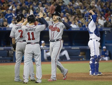 The Braves' Freddie Freeman celebrates his home run in the 6th inning as the Toronto Blue Jays host the Atlanta Braves in Toronto, Ont. Tuesday May 16, 2017. Stan Behal/Toronto Sun/Postmedia Network