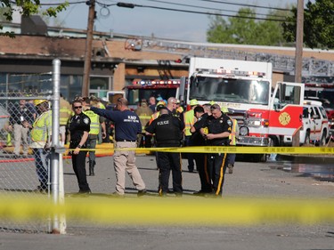 Authorities respond to the site of a small plane crash that killed crew members near Teterboro Airport in Carlstadt, N.J., just west of New York City, Monday, May 15, 2017. Police said the Learjet 35 crashed into a building near the airport killing the two crew members. According to police, no passengers were aboard the plane when it went down Monday afternoon. (AP Photo/Seth Wenig) ORG XMIT: NYR104