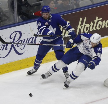 Toronto's Seth Griffin goes against  Slater Koekkeok in Game 6 of their playoff round Toronto Marlies down 3 games to 2 and host the Syracuse Crunch in AHL playoff actioni n Toronto on Monday May 15, 2017. Michael Peake/Toronto Sun/Postmedia Network