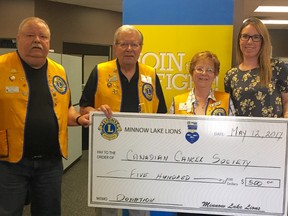Minnow Lake Lions Club representatives Blaine Lachance, Walter Karen and Leanne Furchner present a cheque to Lindsey Jones, volunteer engagement co-ordinator for the Canadian Cancer Society in Sudbury. Supplied photo
