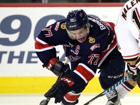 Regina Pats centre Adam Brooks battles for the puck deep in his own end as the Calgary Hitmen took on the Regina Pats in regular season action on January 27, 2017 at the Saddledome. (RYAN MCLEOD FOR POSTMEDIA)