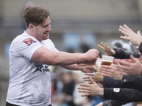 Toronto Wolfpack's Jake Emmitt greets fans after their 62-12 win against Oxford in their inaugural home opener in Kingstone Press League 1 Rugby action in Toronto on Saturday, May 6, 2017. (THE CANADIAN PRESS/Chris Young)