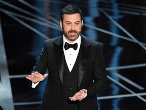 In this Feb. 26, 2017 file photo, host Jimmy Kimmel appears at the Oscars in Los Angeles. The Academy of Motion Picture Arts and Sciences on Tuesday, May 16, 2017, said Kimmel will return for the 90th Oscars on March 4, 2018. (Photo by Chris Pizzello/Invision/AP, File)