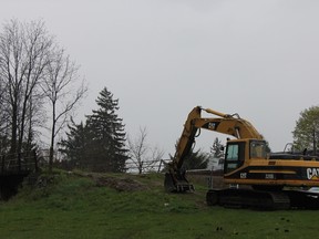 Heavy equipment sits idle on May 2 at what will become the entrance to St. Thomas’s elevated park. Rain has somewhat delayed the construction of the ramp that will give access to visitors to the park. JONATHAN JUHA/TIMES-JOURNAL/POSTMEDIA NETWORK