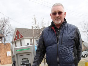 City of Sarnia Economic Development Director Peter Hungerford stands by the city's electric vehicle charging station at the Charlotte Street parking lot in March. Another five charging stations are being eyed for the city. (Tyler Kula/Sarnia Observer/Postmedia Network)