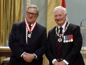 Lloyd Axworthy of Winnipeg is invested as Companion of the order of Canada by Governor General David Johnston during a ceremony at Rideau Hall the official residence of the Governor General, in Ottawa, Friday, February 17, 2017. Former foreign affairs minister Axworthy has been tapped to lead a new international group in search of practical solutions to the world's massive refugee crisis. THE CANADIAN PRESS/Fred Chartrand
