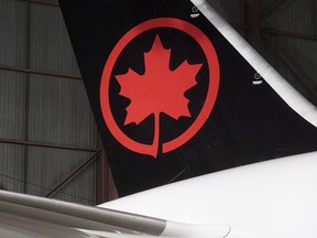 The tail of the newly revealed Air Canada Boeing 787-8 Dreamliner aircraft is seen at a hangar at the Toronto Pearson International Airport in Mississauga, Ont., Thursday, February 9, 2017. (THE CANADIAN PRESS/Mark Blinch)