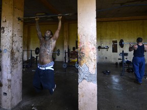 Federal prosecutors claim that Oscar Duran - an El Salvador national - who lives in the Boston area is one of the U.S. leaders of MS-13. Here, members of the gang work out. (Marvin Recinos/AFP/Getty Images)