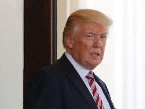 U.S. President Donald Trump watches Turkish President Recep Tayyip Erdogan depart the White House in Washington, Tuesday, May 16, 2017. (AP Photo/Pablo Martinez Monsivais)