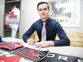 Vincent Bonhomme, a recruit from The Baseball Academy signs his contract to play college baseball at Fanshawe College at The Baseball Academy in Sudbury, Ont. on Tuesday May 16, 2017. Gino Donato/Sudbury Star/Postmedia Network