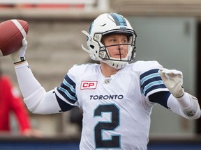 Toronto Argonauts quarterback Drew Willy throws a pass during first half CFL football action against the Montreal Alouettes in Montreal, Sunday, October 2, 2016. THE CANADIAN PRESS/Graham Hughes