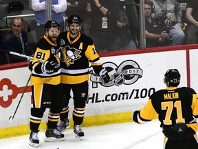 Phil Kessel of the Pittsburgh Penguins celebrates with Chris Kunitz and Evgeni Malkin after scoring a goal against the Ottawa Senators during Game 2 at PPG PAINTS Arena on May 15, 2017. (Matt Kincaid/Getty Images)