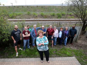 Neighbours from Eastway Gardens neighbourhood are upset about plans to remove the berm between the Via Rail track and the LRT yard behind it. TONY CALDWELL / POSTMEDIA NETWORK