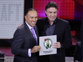 NBA Deputy Commissioner Mark Tatum poses for photographs with Boston Celtics co-owner Wyc Grousbeck after the Celtics won the first pick in the NBA draft at the lottery on May 16, 2017. (AP Photo/Frank Franklin II)