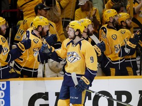 Nashville Predators left wing Filip Forsberg (9), of Sweden, is greeted by teammates after scoring a goal during the third period in Game 3 of the Western Conference final against the Anaheim Ducks in the NHL hockey Stanley Cup playoffs Tuesday, May 16, 2017, in Nashville, Tenn. The Predators won 2-1. (AP Photo/Mark Humphrey)