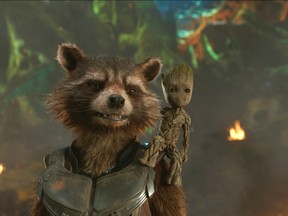 This image released by Disney shows the Rocket, voiced by Bradley Cooper, left, and Groot, voiced by Vin Diesel in a scene from Marvel's "Guardians Of The Galaxy Vol. 2." (Marvel Studios/Disney via AP)