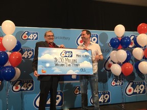 William 'Bud' Perry (left), of Pickering, collects his $30 million Lotto 6/49 jackpot on Wednesday, May 17, 2017 with his son Sean Perry in Toronto. (Kevin Connor/Toronto Sun)