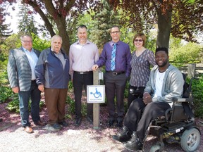 The City of Sarnia and the County of Lambton are being recognized provincially for installing mobility device charging stations at public spaces in Sarnia and Point Edward. Pictured here at the outdoor Strangway charging stations are Lambton County Warden Bill Wever; Plympton-Wyoming Mayor Lonny Napper, chair of the Lambton Accessibility Advisory Committee; Sarnia city Coun. Brian White, who serves on the Sarnia Accessibility Advisory Committee; Dale Mosley, accessibility coordinator with the City of Sarnia; Heather Allen, supervisor of program review and compliance with the County of Lambton; and local accessibility advocate Dan Edwards. (Handout/Sarnia Observer/Postmedia Network)