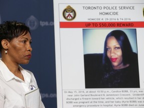 Det.-Sgt. Mike Carbone issued a plea to the public on the one-year anniversary of the shooting death of Candice Rochelle Bobb - who was five months pregnant - at Jamestown Crescent and John Garland Boulevard. Bobb's mother Jackie listens to Carbone speak on Wednesday May 17, 2017. Jack Boland/Toronto Sun/Postmedia Network