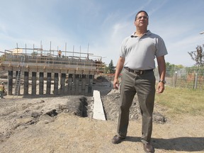 Lester Deane poses near the construction of the Chief Peguis Trail in 2011. He is now the city's former public works director and is no longer a city employee.