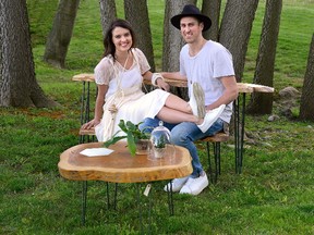 Jennifer and Jesse Lofthouse with tables they make from trees for Homes story. (MORRIS LAMONT, The London Free Press)