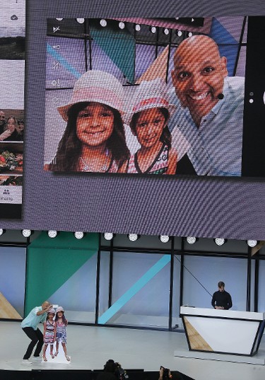 Anil Sabharwal demonstrates updates to Google Photos during the keynote address of the Google I/O conference, Wednesday, May 17, 2017, in Mountain View, Calif. (AP Photo/Eric Risberg)