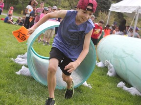 Ethan Zwicker, 10, runs through an obstacle course at the St. Thomas-Elgin Children’s Water Festival on Wednesday. The St. Anne’s student was one of 3,300 children to participate in the event that is happening over four days at Pinafore Park. (Laura Broadley/Times-Journal)