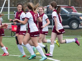 Members of the Regiopolis-Notre Dame Panthers, from left, Bella Meban de Groot, Adrienne Graham, Hannah O'Brien and Emma McLean celebrate a goal during a 5-2 Kingston Area Secondary Schools Athletic Association senior girls soccer win over the Sydenham Golden Eagles on May 3. Regi, which won the pennant with a 5-0-1 record, takes on the third-place Holy Cross Crusaders (4-1-1) in the championship game Thursday at Richardson Stadium at 1 p.m. (Tim Gordanier/The Whig-Standard)