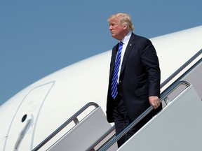 U.S. President Donald Trump walks down the steps of Air Force One at Andrews Air Force Base in Md., Wednesday, May 17, 2017. Trump went to the U.S. Coast Guard Academy in New London, Conn., where he gave the commencement address. (AP Photo/Susan Walsh)