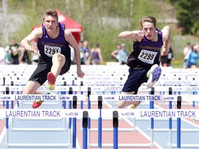 Brendan Fabbro and Andrew Langley both of Lo Ellen Park Secondary School race in the hurdles at the Sudbury District Secondary Schools' Athletic Association 76th annual track and field championship at the Laurentian Community Track Complex in Sudbury, Ont. on Wednesday May 17, 2017. Gino Donato/Sudbury Star/Postmedia Network