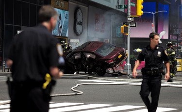 Police secure an are near a car after it plunged into pedestrians in Times Square in New York on May 18, 2017.  A speeding car struck pedestrians in New York's Times Square on, killing one person and injuring 12 others in an accident in one of Manhattan's most popular tourists spots, officials said. / AFP PHOTO / Jewel SAMADJEWEL SAMAD/AFP/Getty Images