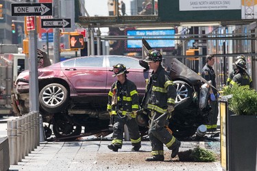 NEW YORK, NY - MAY 18: A wrecked car sits in the intersection of 45th and Broadway in Times Square, May 18, 2017 in New York City. According to reports there were multiple injuries and one fatality after the car plowed into a crowd of people. (Photo by Drew Angerer/Getty Images)