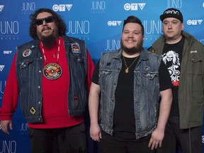 A Tribe Called Red pose on the red carpet as they arrive at the Juno awards show Sunday, April 2, 2017 in Ottawa. Shawn Mendes, Grimes and A Tribe Called Red are the leading nominees heading into the iHeartRadio Canada MuchMusic Video Awards on June 18. (THE CANADIAN PRESS/Sean Kilpatrick)