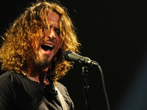 FILE - In this Feb. 13, 2013 file photo, Chris Cornell of Soundgarden performs during the band's concert at the Wiltern in Los Angeles. Cornell, 52, who gained fame as the lead singer of the bands Soundgarden and Audioslave, died at a hotel in Detroit and police said Thursday, May 18, 2017, that his death is being investigated as a possible suicide. (Photo by Chris Pizzello/Invision/AP, File)