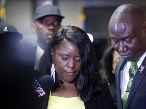 Tiffany Crutcher, sister of Terence Crutcher, speaks with attorney Benjamin Crump after Tulsa Police officer Betty Jo Shelby was found not guilty of manslaughter in the Sept. 2016 fatal shooting of Terence Crutcher, Wednesday, May 17, 2017. (Mike Simons/Tulsa World via AP)