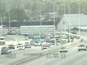 Westbound Hwy 417 traffic backed up due to two-car crash and rollover.