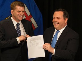 Wildrose Party leader Brian Jean and Alberta PC leader Jason Kenney announce that they have reached a deal to merge the parties and create the United Conservative Party, during a press conference in Edmonton Thursday May 18, 2017. Photo by David Bloom