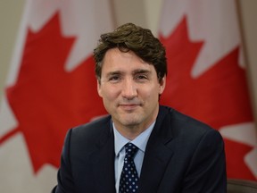 Prime Minister Justin Trudeau’s carbon pricing plan is exposed as a political fraud by its failure to explain how it will help achieve the government’s emission reduction targets for 2020 and 2030. (THE CANADIAN PRESS/PHOTO)