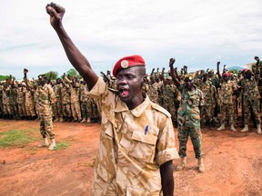 Soldiers of the Sudan People's Liberation Army (SPLA) cheer cheer during the commemoration of Sudan People's Liberation Army (SPLA) Day at the SPLA headquarters in Juba, South Sudan, on May 18, 2017, during the commemoration of SPLA Day.
SPLA Day is marked annually in remembrance of a group of Sudanese soldiers who mutinied in 1983 in the South Sudanese area of Bor - Jonglei, sparking off more than two decades of civil war which culminated in the independence of South Sudan in 2011. (ALBERT GONZALEZ FARRAN/AFP/Getty Images)