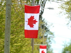 Canadian flags are already on display on Thornton Avenue in the neighbourhood of old north London, Ont. on May 9, 2017. (MIKE HENSEN, The London Free Press)
