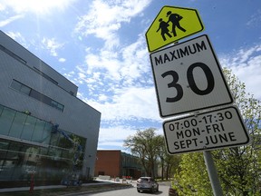 A reduced-speed school zone warning sign near Ellen Douglass School on Elgin Avenue in Winnipeg on Mon., May 15, 2017. The school has been operating an off-campus high school class and the building has been sold, but the city still has it designated a school zone. (Kevin King/Winnipeg Sun/Postmedia Network)