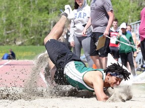 Oliver Ecclestone-Sterling of Lockerby Composite School lands hard during the long jump the Sudbury District Secondary School's Athletic Association 76 Annual Track and Field Championships at the Laurentian Community Track Complex in Sudbury, Ont. on Thursday May 18, 2017. Gino Donato/Sudbury Star/Postmedia Network