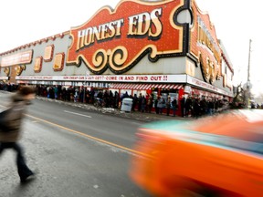 The Las Vegas-style Honest Ed's sign will be taken to storage where it will be refurbished and later displayed at the Ed Mirvish Theatre on Victoria St. (TORONTO SUN/FILES)