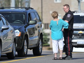 A Barrie police officer talks with a woman following a suspected road-rage incident which sent a man to hospital Thursday morning. Police say they received multiple calls at 8:45 a.m. about an altercation between two men who were arguing on Ferndale Drive South. Police believe one man became upset at the other motorist’s driving skills. The verbal altercation turned into a physical confrontation, resulting in one driver being transported to Royal Victoria Regional Health Centre with undisclosed injuries. A 54-year-old Barrie man has been charged with assault. MARK WANZEL/PHOTO